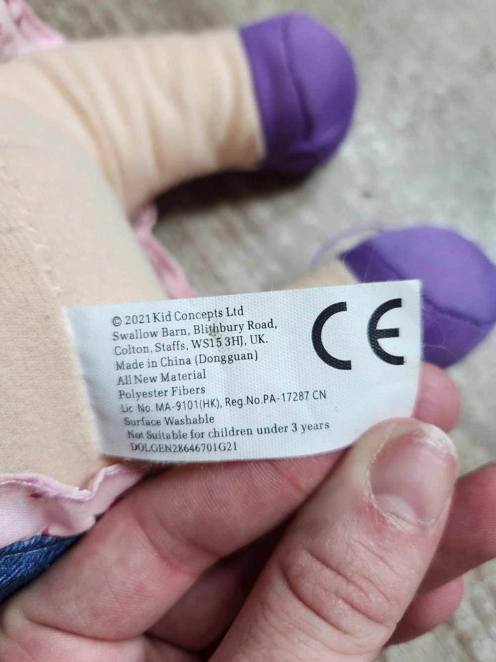Blonde Baby Doll in Pink Outfit with Denim Pinafore and Purple Shoes